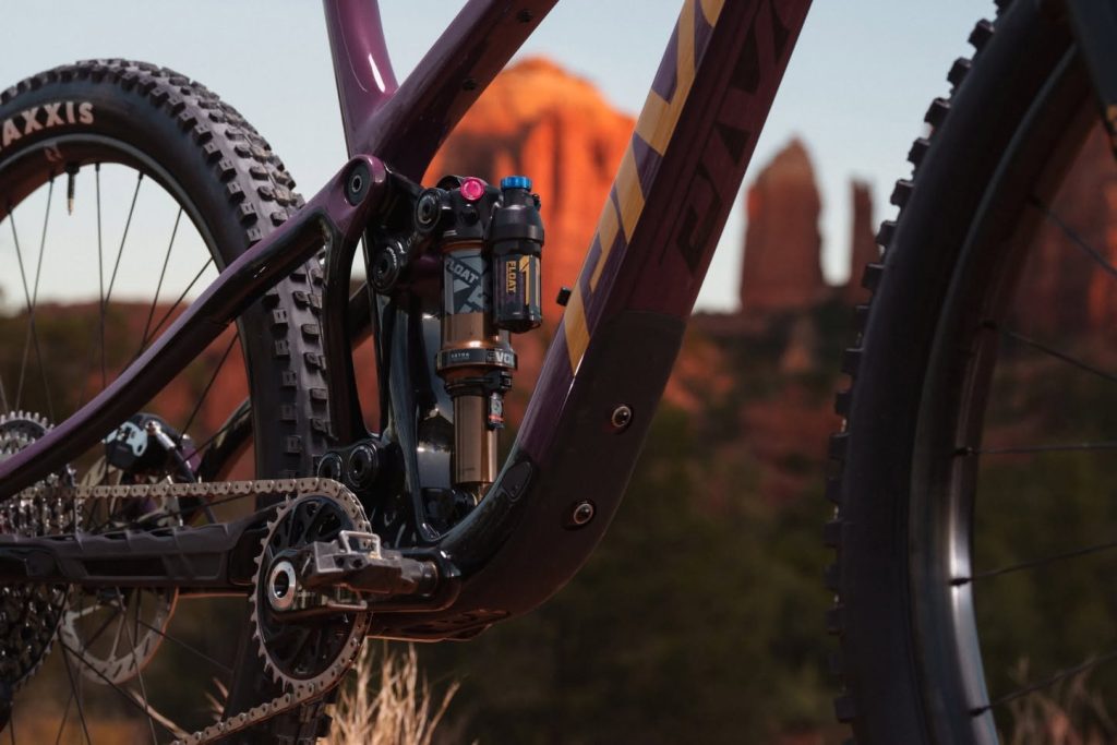 A pristine, professionally equipped mountain bike suspension tuning workshop and tool layout.
