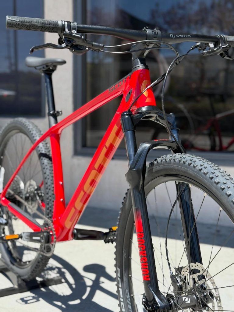 A premium custom-built blue Pivot full-suspension mountain bike ready for the trails.